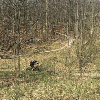 Person mountain biking