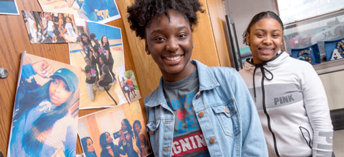 Students in dorm room after completing housing application
