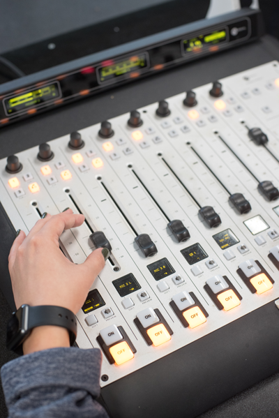 A media studies student learning audio production.