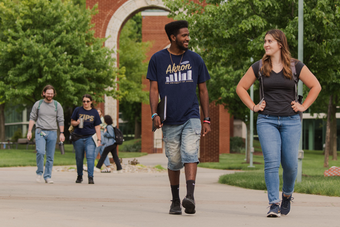 University of Akron students walking on the Coleman Commons