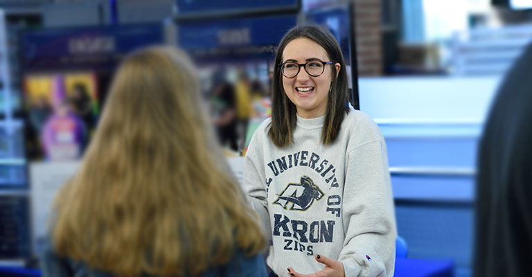 Image of adult non-traditional student meeting with professor at the University of Akron